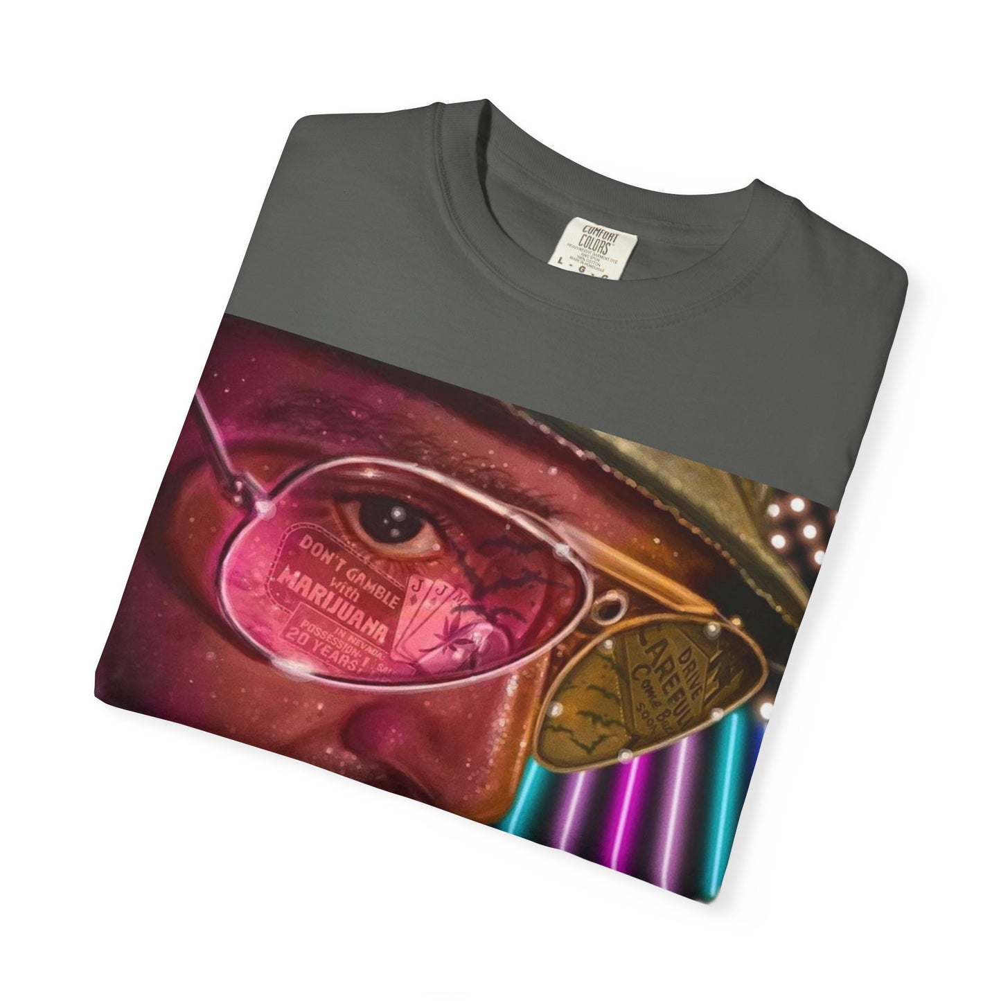 Folded DarkThoughts ‘Fear and Loathing’ pepper graphic t-shirt featuring psychedelic neon artwork with surreal sunglasses and desert visuals — bold alternative streetwear.