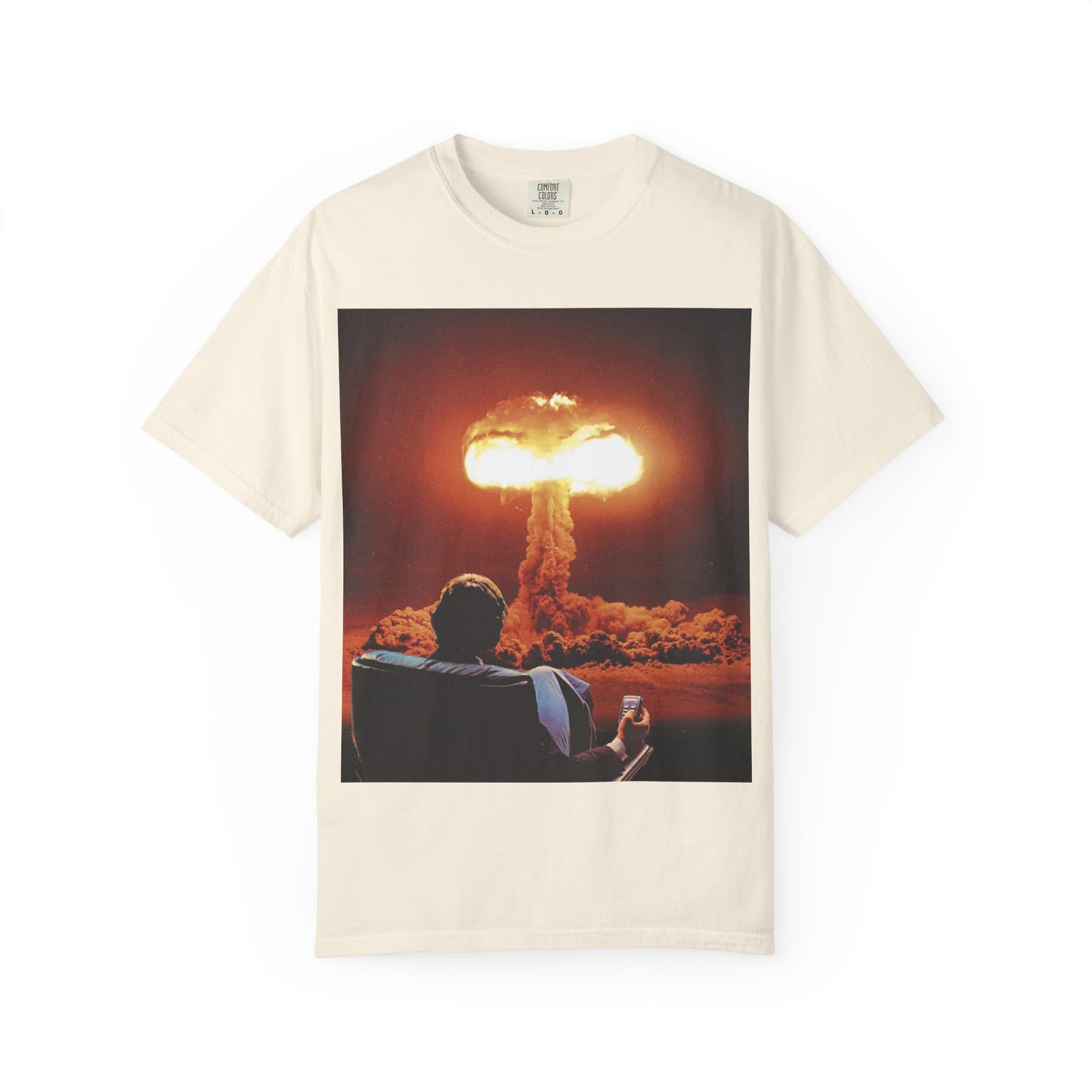 DarkThoughts ‘End of Broadcast’ ivory graphic t-shirt featuring a silhouette figure watching a massive explosion in vivid orange tones — dark grunge alternative streetwear tee.