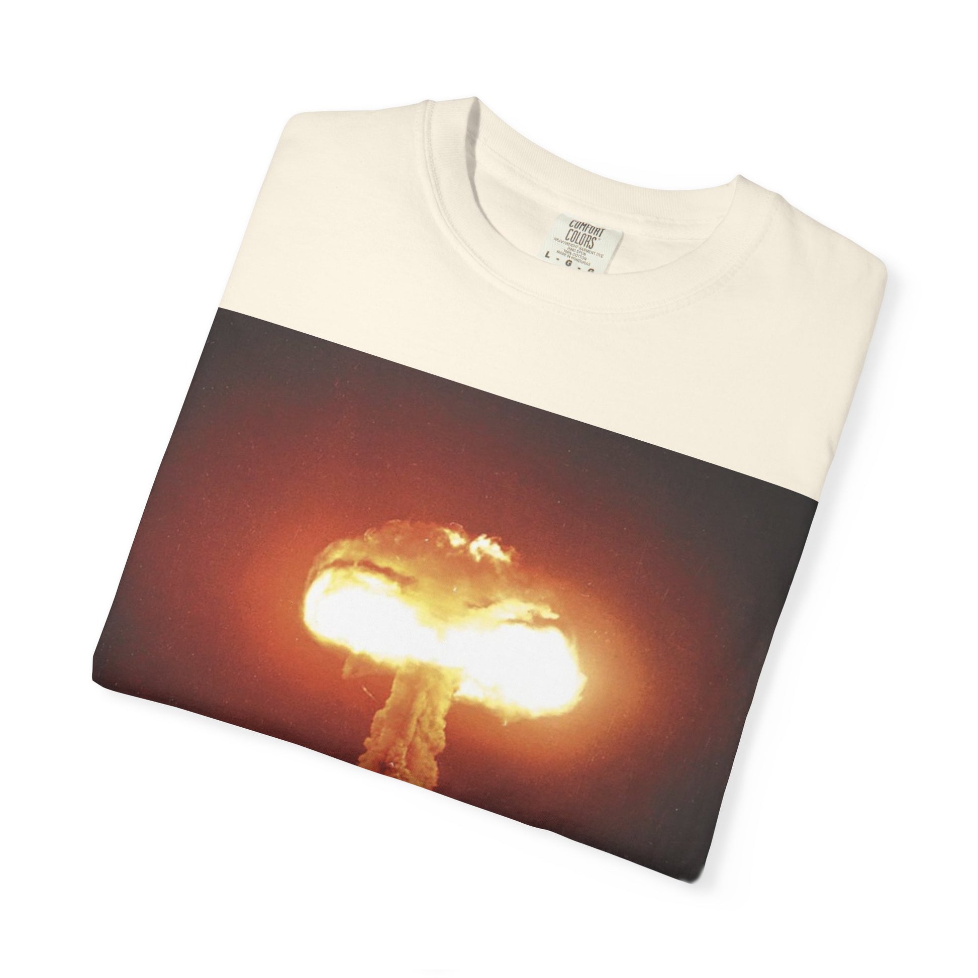 DarkThoughts ‘End of Broadcast’ ivory graphic t-shirt featuring a silhouette figure watching a massive explosion in vivid orange tones — dark grunge alternative streetwear tee.
